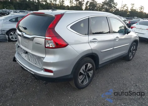 2015 Honda Cr-V Touring z USA, uszkodzony, nr VIN 5J6RM4H95FL109626